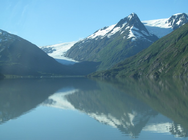 A view of the Portage Glacier with reflection in Portage Lake near Whittier, Alaska.